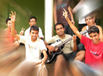  Students enjoying leisure time by playing guitar